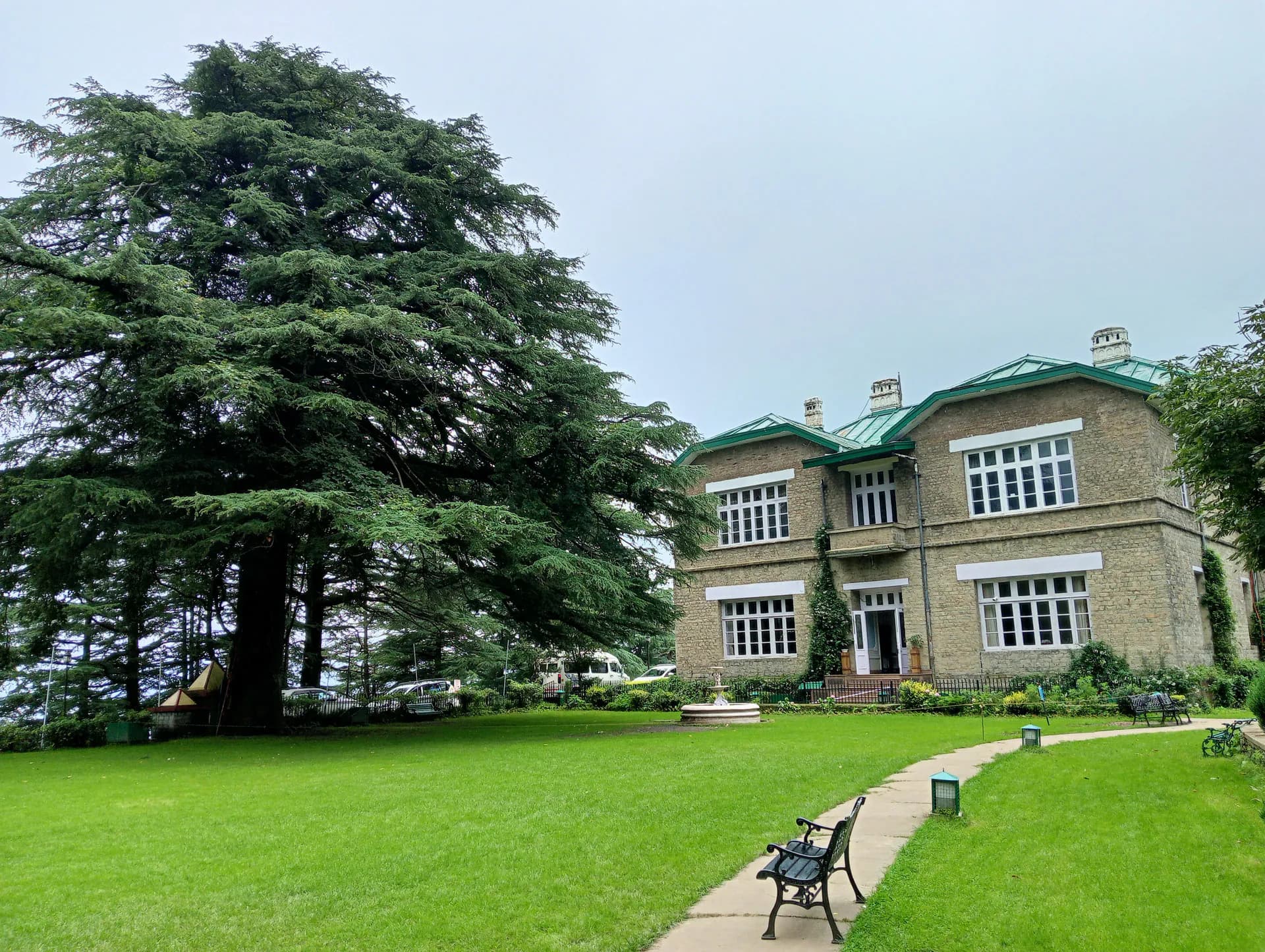 The grand stone architecture and lush lawns of the historic Chail Palace near Kandaghat