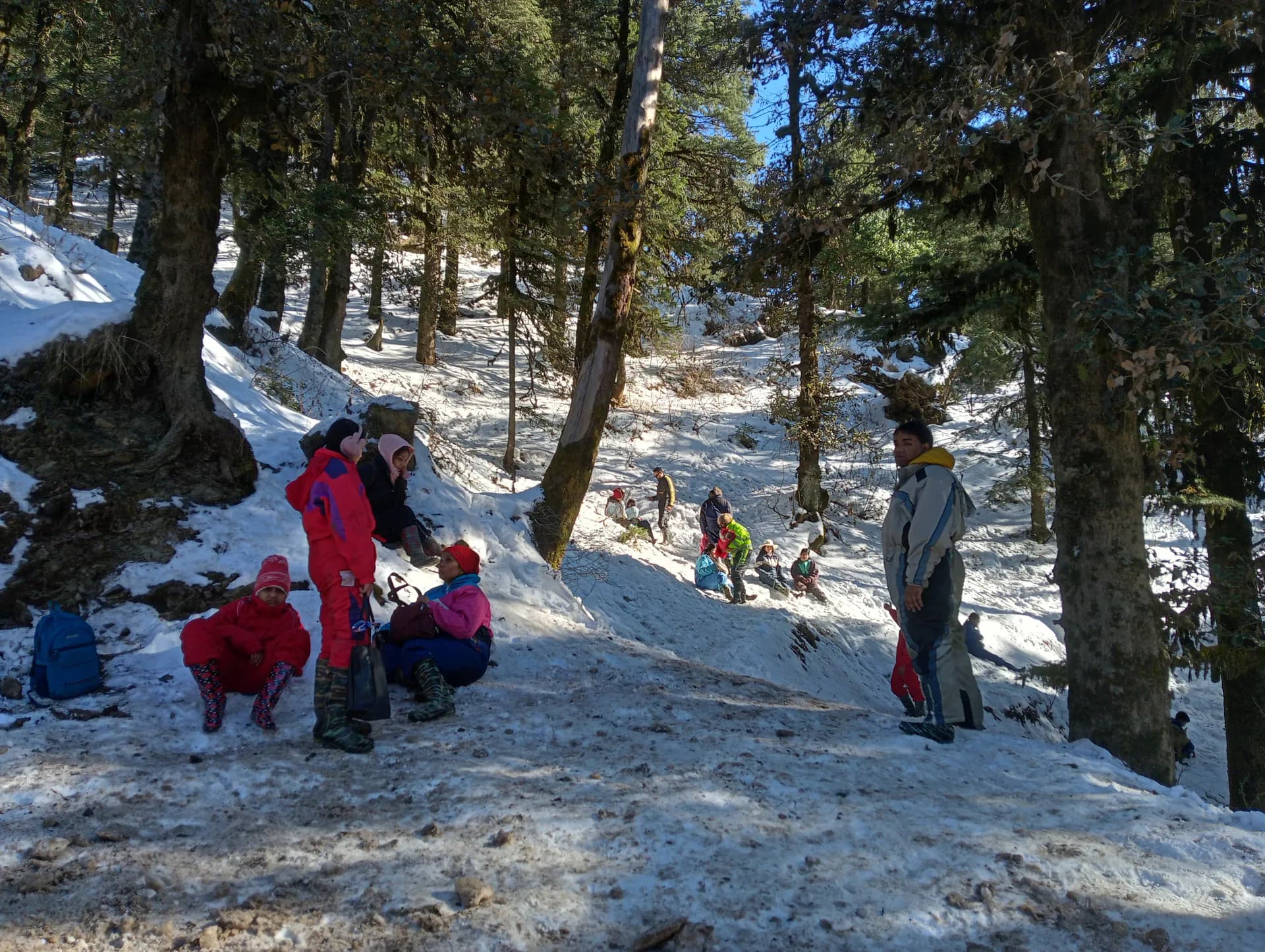 Tourists enjoying a snowy winter landscape in Kufri, a popular hill escape near Shimla