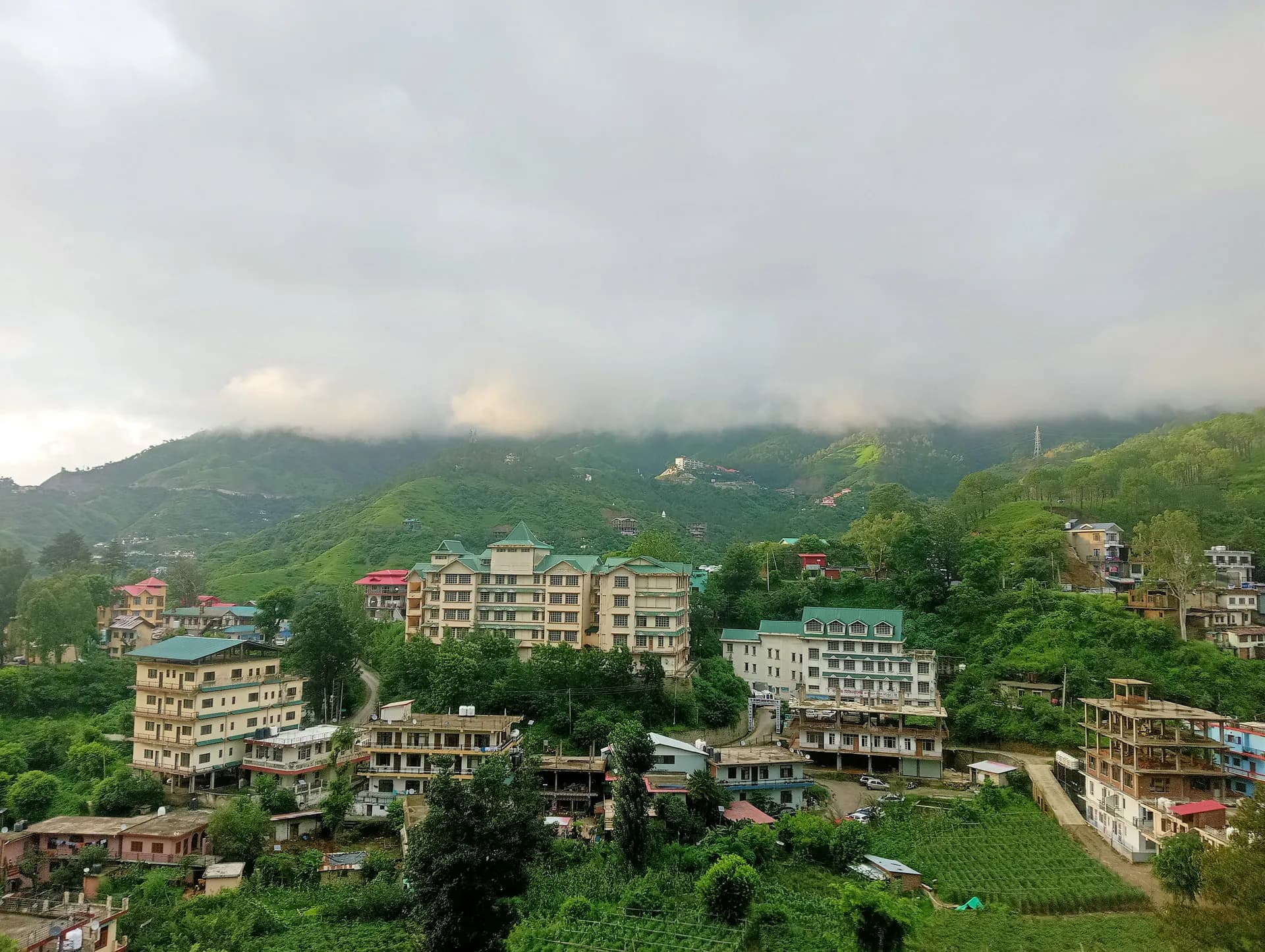 Scenic aerial view of the peaceful Kandaghat village landscape surrounding Mohija Homestay